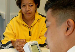TRUST technician provides onsite test results to screening participant